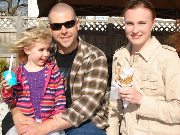 Trailside Treats attracts ice cream lovers hungry for spring The Boroden family of New Hampton (from left): Aubrielle, 4 (on dad Travis’s lap), and mom, Meghan, are loving the ice cream and Italian Ice at Trailside Treats on opening day. (Photo by Geri Corey)