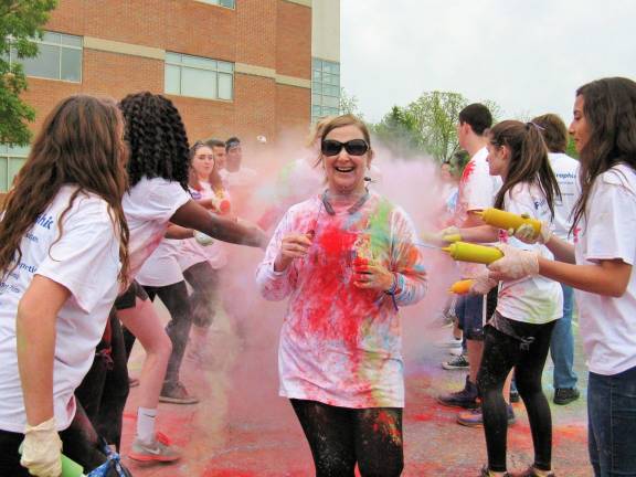 Color run along Heritage Trail to raise funds for colon cancer research A volunteer gets doused at a past color run at the Chester Academy (Photo by Ginny Privitar)