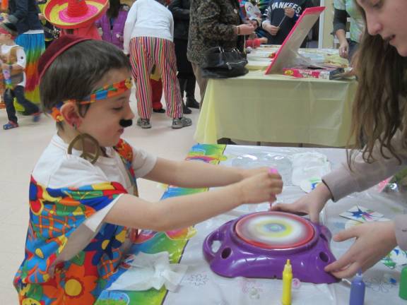 Flower children gather to celebrate Purim Mendy Boresntein and Shir Kidron from Goshen.