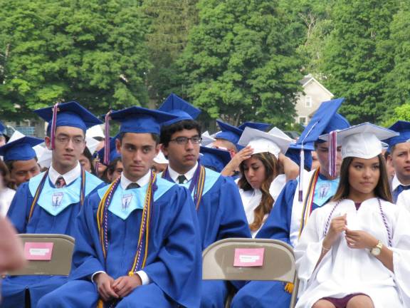 Goshen's Class of 2014 A cap adjustment.