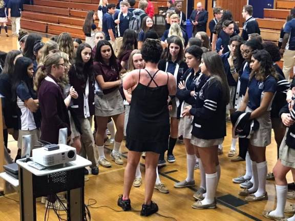 'I’m living proof of what happens to people who make poor choices' Sarah Panzau Evans with Burke Catholic High School students (Photo provided)