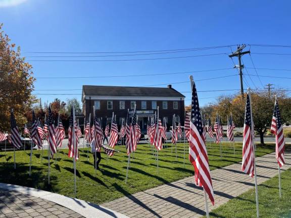 Flags on the Charles J. Everett Memorial last year in Goshen.