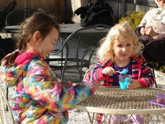Trailside Treats attracts ice cream lovers hungry for spring Isabella Moody, a first-grader from Lynhurst, N.J., was happy to visit her grandmother Louise Glancey of Goshen so they could come to Trailside Treats for an ice cream. Isabella (left) dips into her ice cream while talking with first-time new friend Aubrielle Boroden, 4, of New Hampton. Louise Glancey has lived in Goshen since 1962. (Photo by Geri Corey)