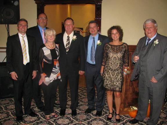 Goshen Chamber of Commerce presents honors From left, Dr. Gerard Galarneau, Chris Fiorillo of the Eva Fini Fund, Linda Mabie of Linda's Office Supplies, Steve Spindler of Steve's Deli, Albert and Aimee Fini of the Eva Fini Fund and Chris Ashman.