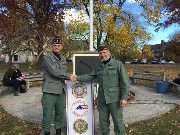 Freedom is never free: If you enjoy yours, thank a veteran Commanders from both American Legion and VFW, James Heslop (left) and Ray Quattrini shake hands at the conclusion of a well attended Veteran's day celebration last year (Photo provided)