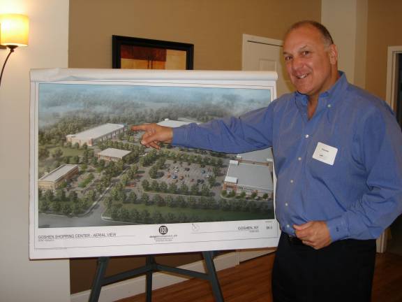 Philip Adler explains preliminary plans for the revitalized Goshen Plaza to members who attended the Goshen Chamber of Commerce breakfast (Photo by Geri Corey)