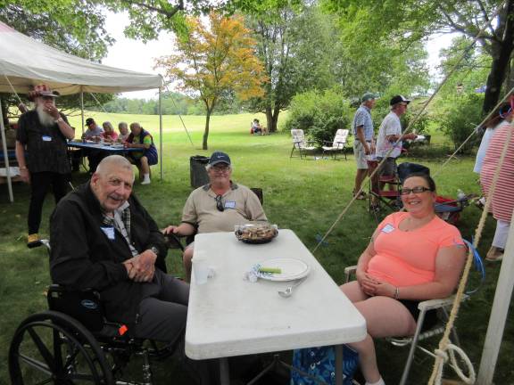 A great day for the Bull family Louis Euvrard, left, came from Albany. He’s pictured with son-in-law John Gould and daughter Gretchen. (Photo by Ginny Privitar)