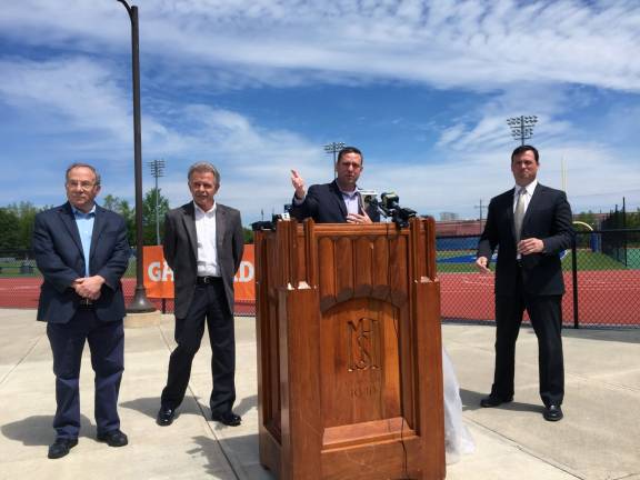 County contributes $6,000 to support Middletown School District's bid to host state sports championships Photo provided by Orange County Pictured from left to right are Orange County Legislators Jeff Berkman and Michael Paduch, Orange County Executive Steven M. Neuhaus and David Coates, Middletown's Director of Physical Education, Health and Athletics at ceremony at Middletown High's Faller Field on Tuesday.