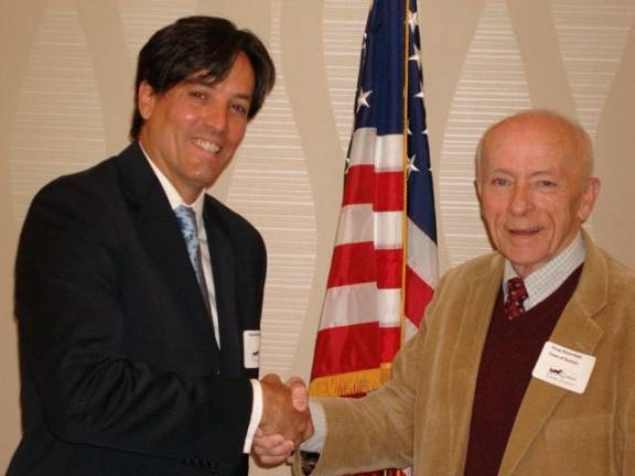 Goshen candidates field questions Town of Goshen supervisor candidates shake hands: Democrat Brad Barnhorst (left) and Republican Doug Bloomfield, incumbent (Photo by Geri Corey)