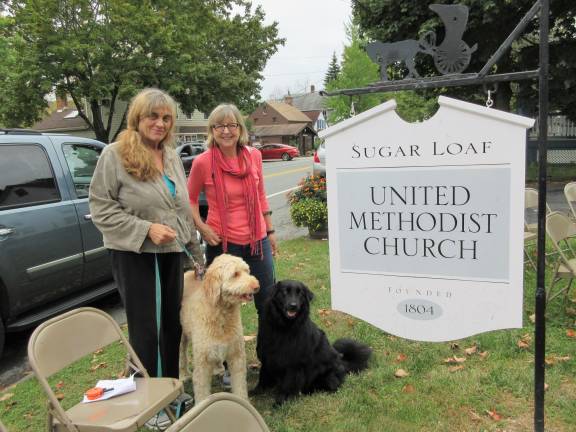 A blessing for Princess Buttercup, and other bright creatures Jean Lozoraitis with Seeley (left) and Holly Vanderkruik with Branson (Photo by Ginny Privitar)