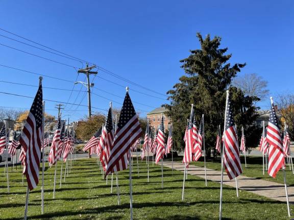 Flags on the Charles J. Everett Memorial last year in Goshen.