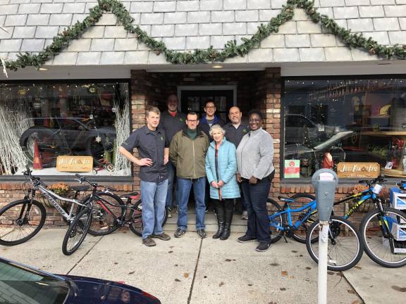 OC Bike Club, Joe’s Fix It’s and The Bicycle Doctor again remember needy children during the holiday season Photos provided At Joe Fix It’s, from the left: Dave Meland, Joe Fix It’s; Shaun Hamilton, Joe Fix It's; Don Karlewicz, club treasurer; Bill Stelz, club president; Peggy Cullen, club vice president; Brian Dunlevy, owner, Joe Fix It’s; and Sharon Williams, Big Brothers / Big Sisters executive director.