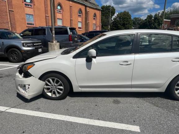 One of the cars damaged during the incident. Photo by Terry Reilly.