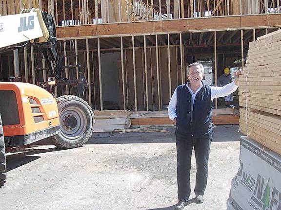 A pleased Luigi Kapiti stands at the rear of his building on Main Street, Goshen, now undergoing complete renovations. He’s anticipating a summer opening for the hotel, The Orange Inn, a Boutique Hotel, and restaurant, Limoncello. Photos by Geri Corey.