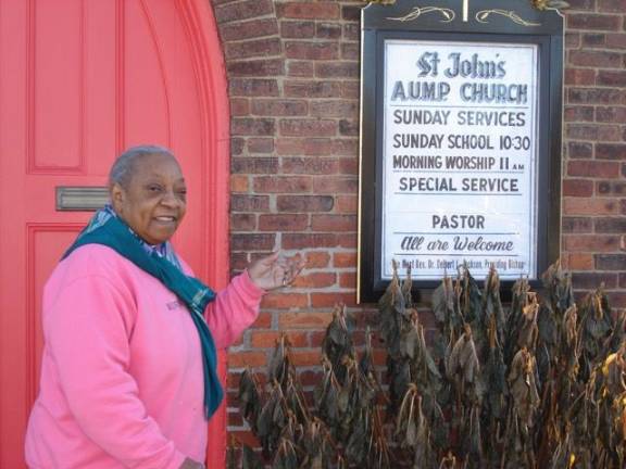 Historic AUMP church survives as 'a beacon of faith' Mary Sumter welcomes one and all to services and fellowship at St. John’s African Union Methodist Protestant Church (Photo by Geri Corey)