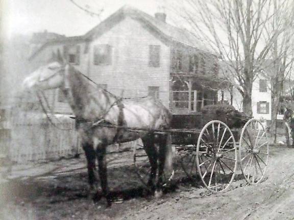 Horse and buggies, once prevalent on the streets of Goshen, traveled on dirt roads, like this one on Middle Street. Photos courtesy of the Village of Goshen Historian Edward P. Connor.