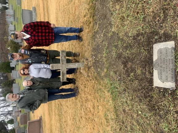 Ron and Maggie Nelson, Joanne Bamond, Christopher Holshek, and Paul Bamond restored the gravesite of Marine Sgt. James R. Ruppert, killed in action in Vietnam in 1971, at Saint Columba Cemetery in Chester.