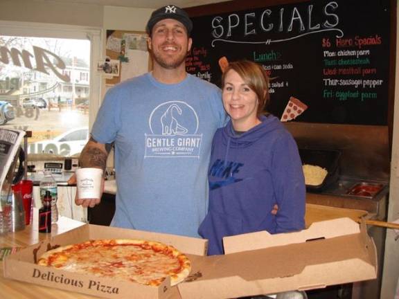 Goshen will get you through the holidays in style Brian and Jamie Veneziano, owners of Amore’s Italian Restaurant. What a combo — freshly made pizza and ice cream for dessert! (Photo by Geri Corey)