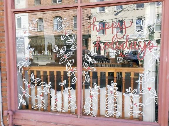 Chester. Chester Academy art students decorate downtown businesses for the holidays