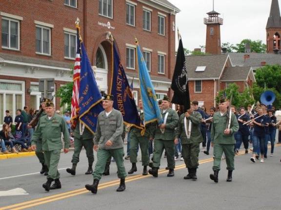 Goshen: 'Our duty to remember' Leading off the parade down Main St. is the American Legion Post #377 and the Veterans of Foreign Wars Post #1708 Combined Color Guard, led by Commander Ray Quattrini (Photo by Geri Corey)