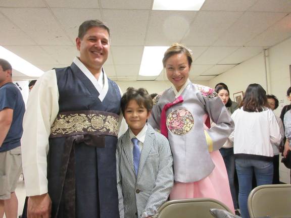 Korean Cultural Night dazzles the community Keith and Kathy Carpentier with son Ty (Photo by Ginny Privitar)