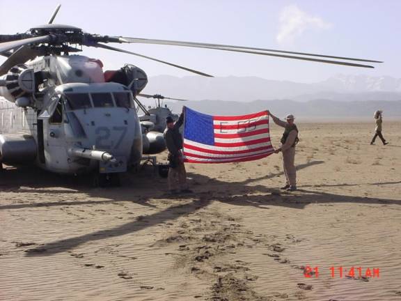 An American flag signed by members of the FDNY Engine 55 in Little Italy, including Camden Olivero’s father, proudly displayed in Afghanistan by Daniel Feliciano.