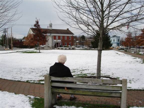 Goshen inspires Christmas greeting Bob Weinberger looking at the scene he sketched for his 2012 card.
