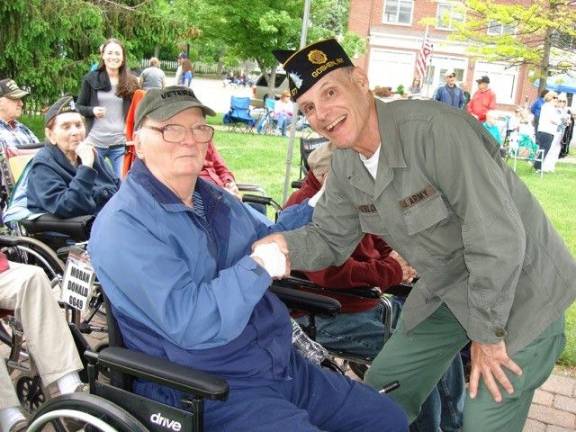 Goshen: 'Our duty to remember' Commander James Heslop of the American Legion Post #377 thanks veteran Donald Moran for his service. (Photo by Geri Corey)