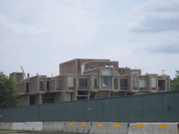 The demolition begins An approximately 10-foot high fence surrounds the Orange County Government Center in Goshen, where demolition of the structure is being completed. (Photo by Nathan Mayberg)