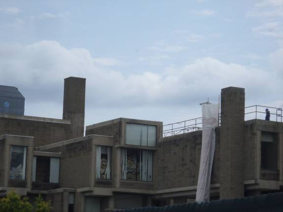 Construction workers were busy on the roof of the Orange County Government Center in Goshen on Thursday as demolition work continues. (Photo by Nathan Mayberg)