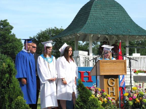 Goshen's Class of 2014 Lucas Maxwell Graves, teacher and coach Edward Killenberger, Erica Lee Miller, Amanda Gelhaus, and Bernadette Smith, at the podium, offer tribute to Lance Golubinski.