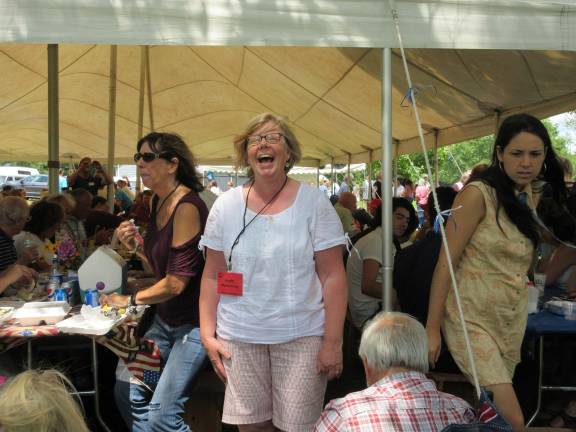A great day for the Bull family Kathi Nywening, secretary of the Bull Stone House organization, enjoyed a laugh. (Photo by Ginny Privitar)