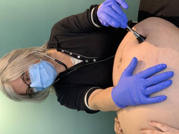 Midwife Susanrachel Birdie Condon with her client Anique Nicholson.