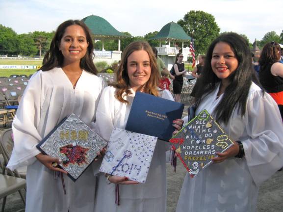 Goshen's Class of 2014 Kaitlyn Rivera, Melissa McCarthy, Ashley Gellman with their specially decorated caps.