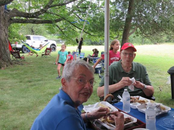 A great day for the Bull family Bob Otto, the oldest man present, and wife, Paula, enjoyed the barbecue dinner. (Photo by Ginny Privitar)