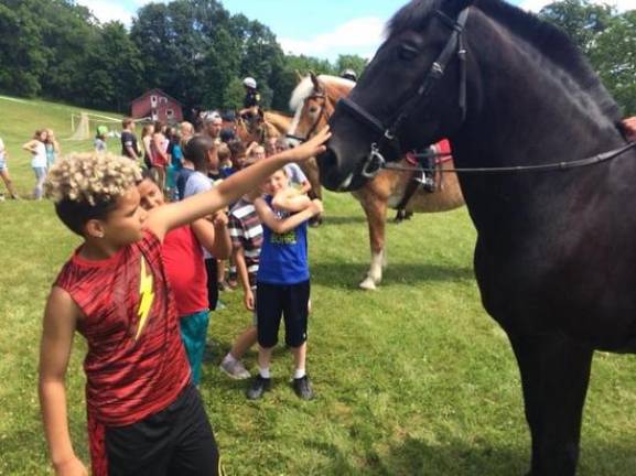 Sheriff DuBois sends local kids to summer camp Campers go riding