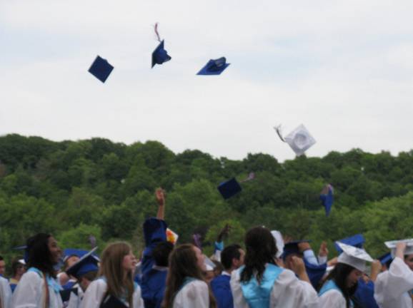 Goshen's Class of 2014 Caps go flying