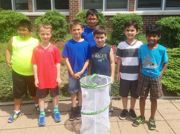 Scotchtown Avenue students raise and release butterflies Rogelio Bautista, Vincent Brescia, Christopher Dumond, Dionicio Baez, Nicholas Dilapi, Nicholas Costescu, and Christopher Harris with the butterflies they helped raise from caterpillars (Photo provided)