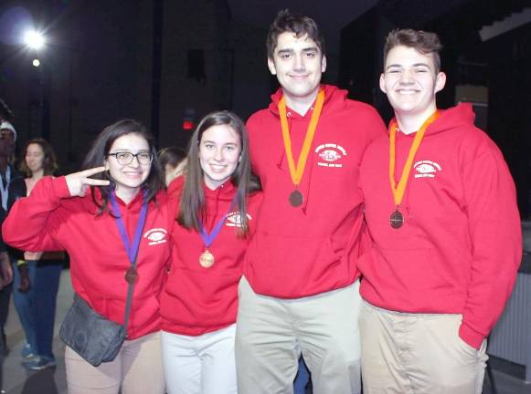 Stephanie Gyrla, Eve Doyle, Ryan Hludzinksi and Ben Pahucki are very excited to show off their medals for the Astronomy event