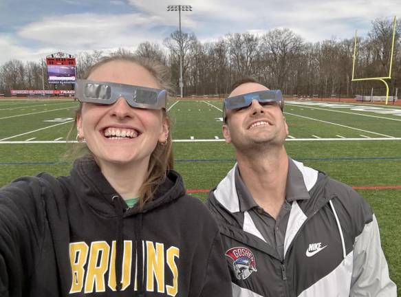 Faculty, staff, and several students took to the athletic fields to observe the celestial event.