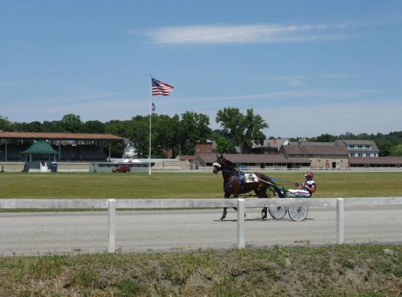 Scenes from Great American Weekend A driver puts his horse through its paces around the Historic Track.