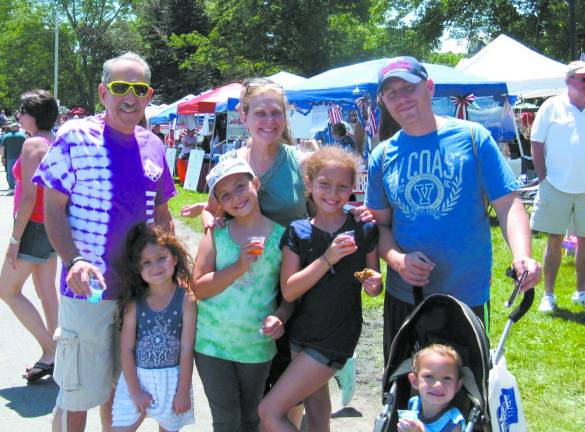 Great American Weekend brings on the crowds Steven Reich, wife Anita, and son Dan, with grandchildren, Ava, 5, Maya, 8; Hailey 10 and Sampson 3, in stroller, after running the 5K that morning.
