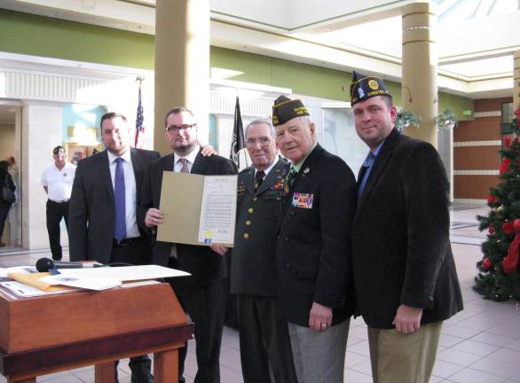 70 years ago, in a dark and snowy wood Wallkill Supervisor Dan Depew; Consul General of Luxembourg M. Jean-Claude Knebeler; Gen. Eliot Hermon; NYS Senator Bill Larkin and Orange County Executive Steve Neuhaus (Photo by Ginny Privitar)