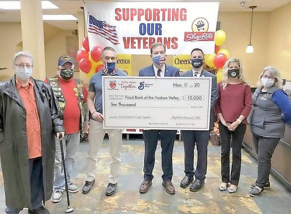 Pictured from left to right are: Marietta Allen, director of St. Mary’s Outreach; Skip O’Donnell, president of the Veterans Coalition of Orange County; Christian Farrell, director of the Orange County Veterans Service Agency; Tom Urtz, vice president of operations for ShopRite Supermarkets Inc., SRS; Brian Maher, Montgomery Town supervisor; Jaci Balcombe, special events coordinator, and Carol Griffin, program coordinator, Food Bank of the Hudson Valley. Photo provided by BML Public Relations.