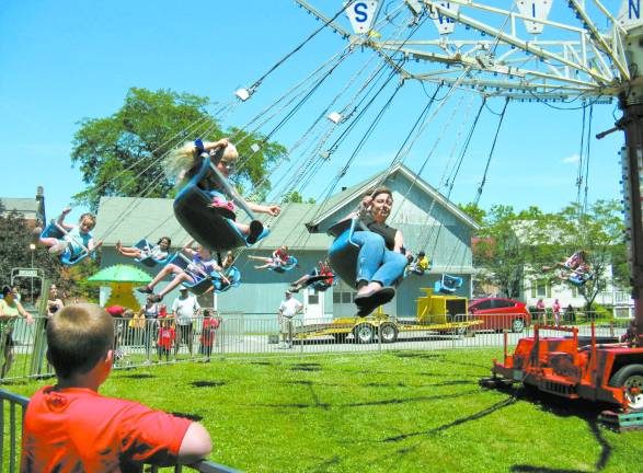 Great American Weekend brings on the crowds The swing ride was a favorite.
