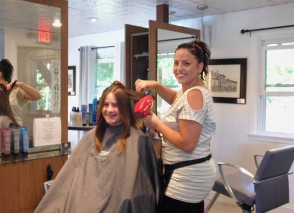 Salon Lucere strives to offer clients 'an experience' Salon Lucere Kelly Messina of New Windsor works on Katie Aulogia of Warwick (Photo by Ginny Privitar)