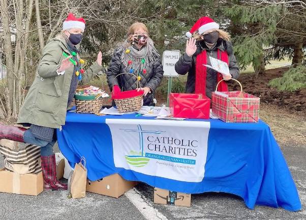 Catholic Charities employee Sheila Toohey, House Tour committee volunteer Therese Urato and Catholic Charities board member and House Tour committee chair Susan Murray-Tetz welcomed the more than 200 vehicles that kicked-off the Christmas season with Catholic Charities’ 2020 drive-by edition of the Goshen Christmas House Tour.