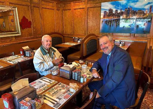 Coffee with OCDA Hoovler Jim Murphy enjoys breakfast with DA David Hoovler.