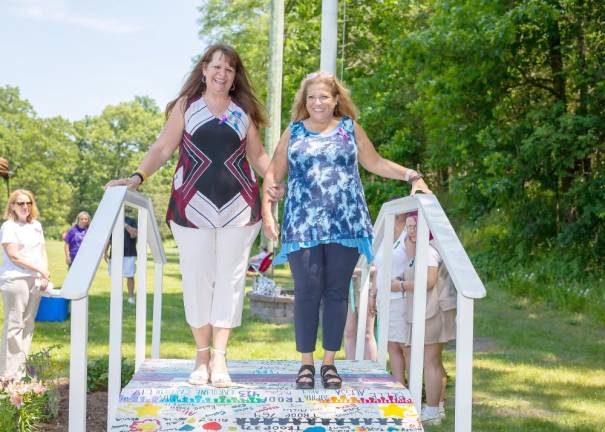 Susan Barberi and Iris Ferraro are among the first to cross the bridge.