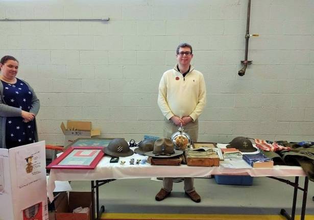 Aaron Lefkowitz at table of World War I artifacts (Photo by Ginny Privitar)